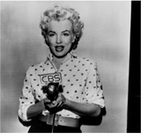 Marilyn during radio show for CBS, March of 1954.