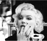 Marilyn Monroe eating cupcake 1958
